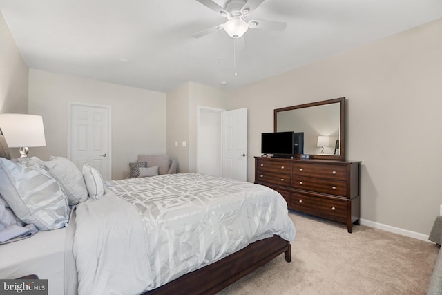 bedroom featuring ceiling fan and light colored carpet