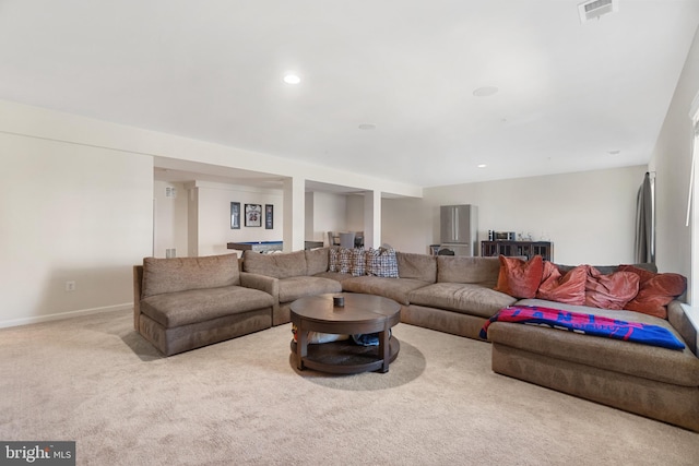 living room featuring light carpet