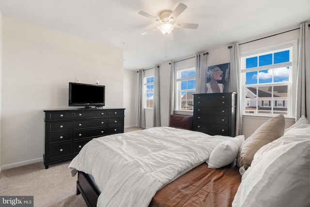 bedroom featuring ceiling fan and light colored carpet