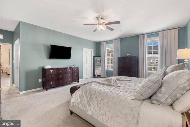 bedroom featuring ceiling fan and light colored carpet