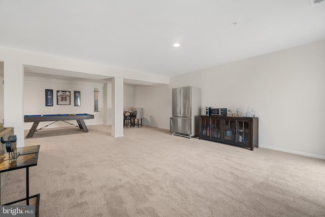 game room featuring light carpet