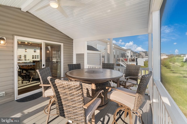 sunroom / solarium featuring vaulted ceiling