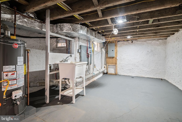 basement with gas water heater, sink, and electric panel