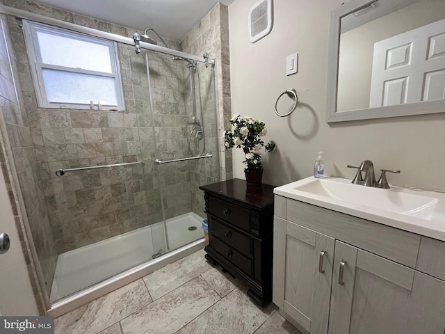 full bath with vanity, visible vents, and a stall shower