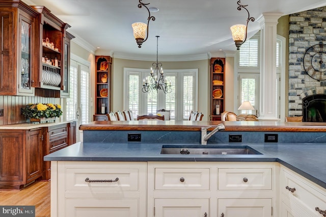 kitchen featuring white cabinetry, plenty of natural light, and sink