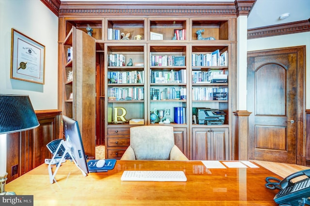 living area with hardwood / wood-style floors and crown molding