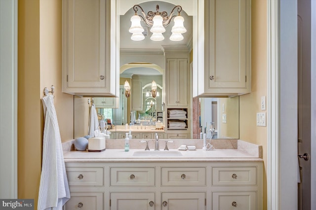 bathroom featuring vanity and ornamental molding