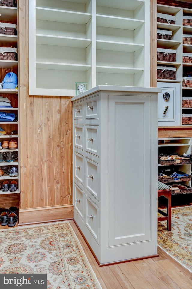 spacious closet with light hardwood / wood-style floors