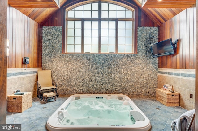 bathroom featuring wooden ceiling, tile patterned flooring, lofted ceiling with beams, wood walls, and tile walls