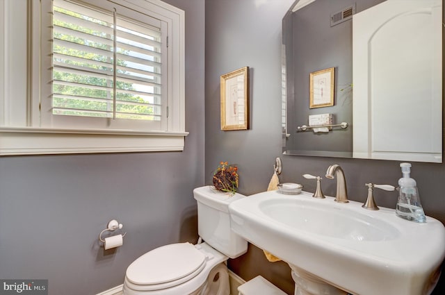 bathroom with toilet and sink