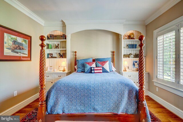 bedroom featuring crown molding and hardwood / wood-style floors