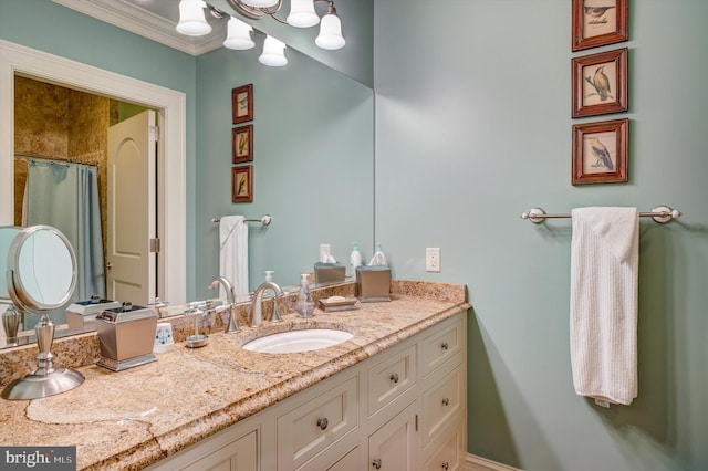 bathroom with vanity and crown molding