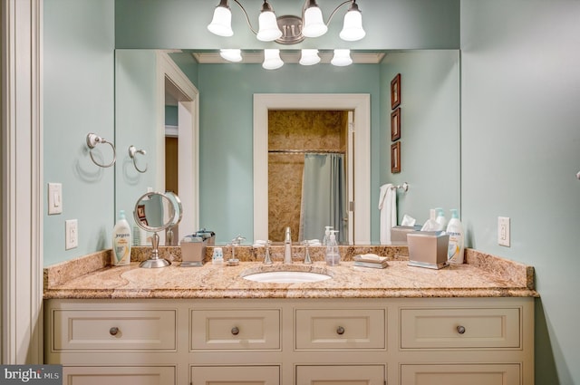 bathroom with curtained shower and vanity