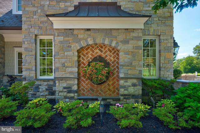 exterior details featuring a fireplace