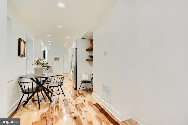 hallway featuring light hardwood / wood-style flooring