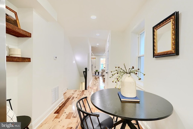 dining space featuring light hardwood / wood-style flooring