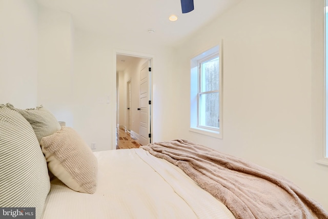 bedroom featuring ceiling fan and ensuite bathroom