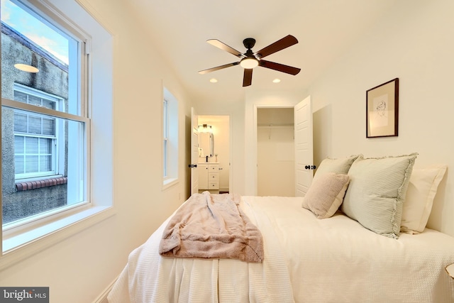 bedroom with multiple windows and ceiling fan