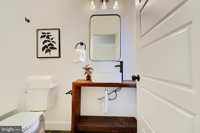 bathroom with toilet and sink