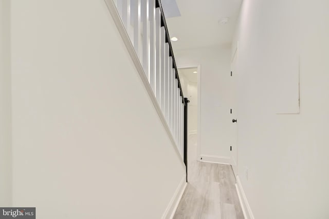 stairs featuring hardwood / wood-style flooring