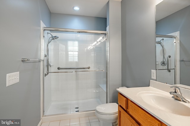 bathroom featuring toilet, tile patterned floors, and walk in shower