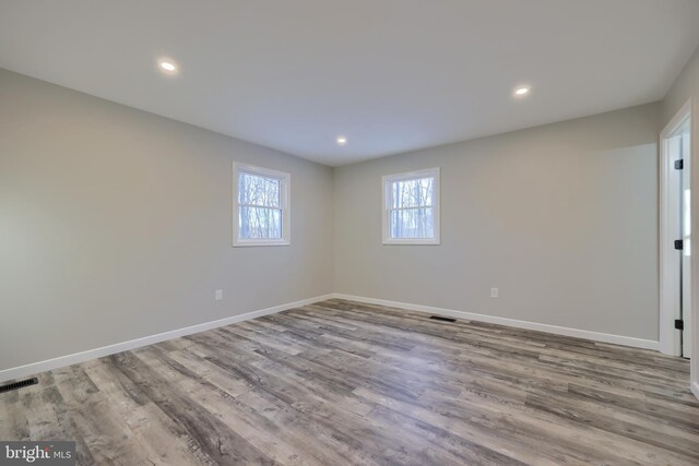 spare room featuring light hardwood / wood-style flooring