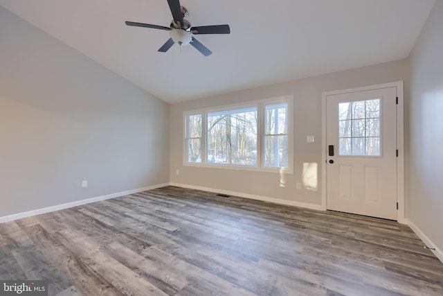 entrance foyer featuring ceiling fan, wood-type flooring, and lofted ceiling