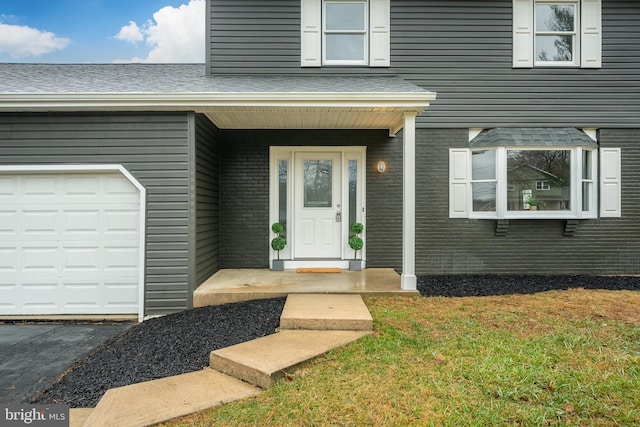 entrance to property featuring a garage