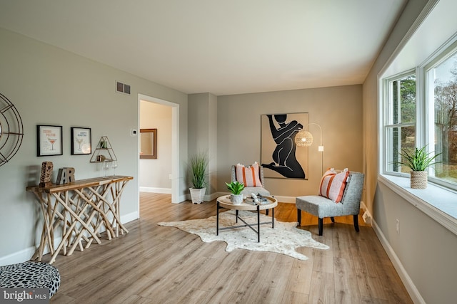 sitting room with light hardwood / wood-style flooring