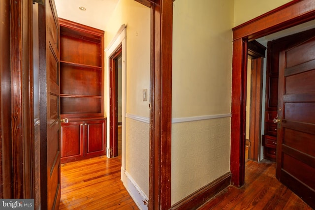 corridor featuring hardwood / wood-style floors