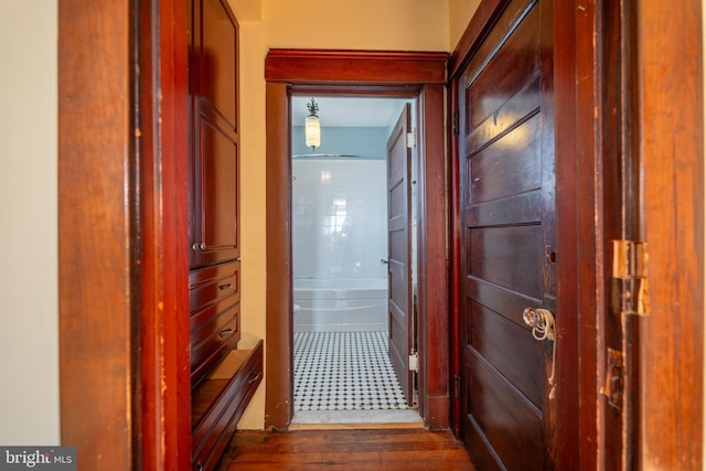 corridor featuring dark hardwood / wood-style floors