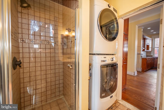 laundry room featuring stacked washer and clothes dryer