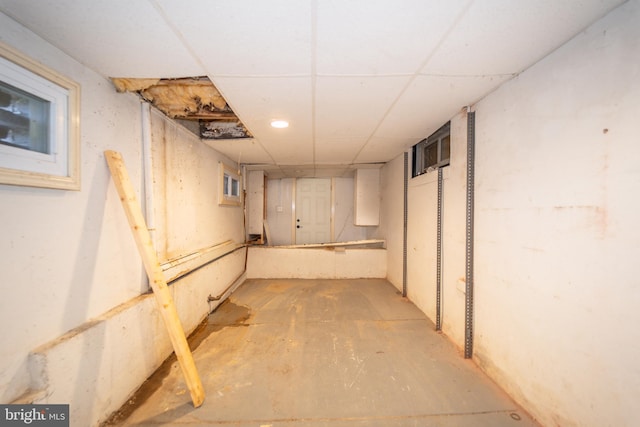 basement featuring a paneled ceiling