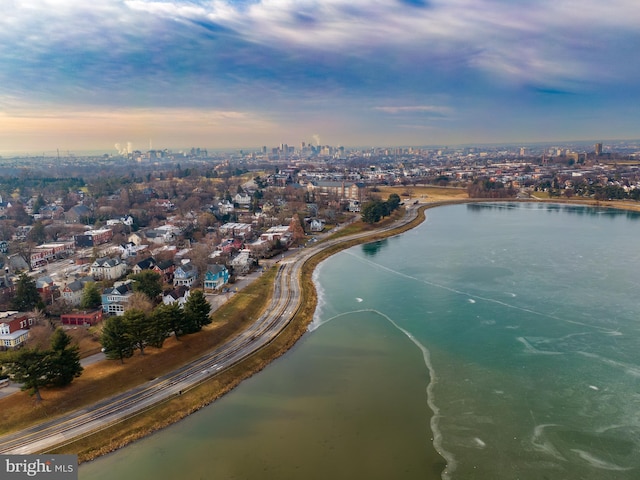 aerial view at dusk with a water view