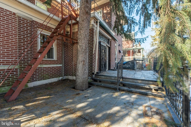 view of side of home featuring a patio