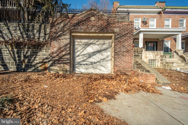 view of property exterior featuring a garage