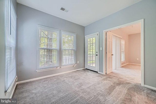 interior space featuring light carpet