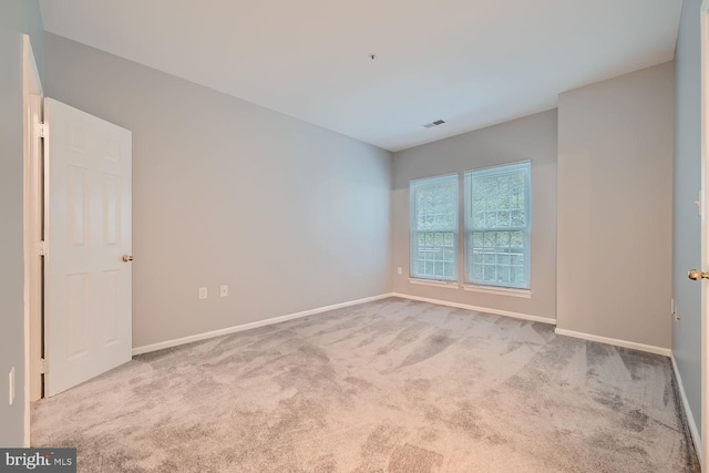 empty room with light colored carpet