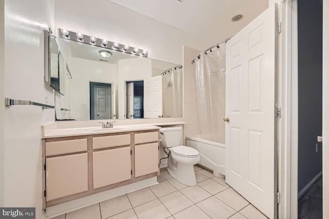 full bathroom featuring tile patterned flooring, shower / bath combination with curtain, vanity, and toilet