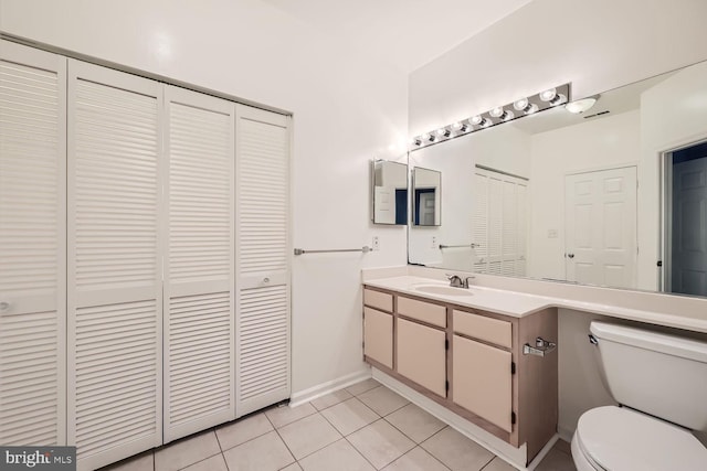 bathroom featuring tile patterned floors, vanity, and toilet