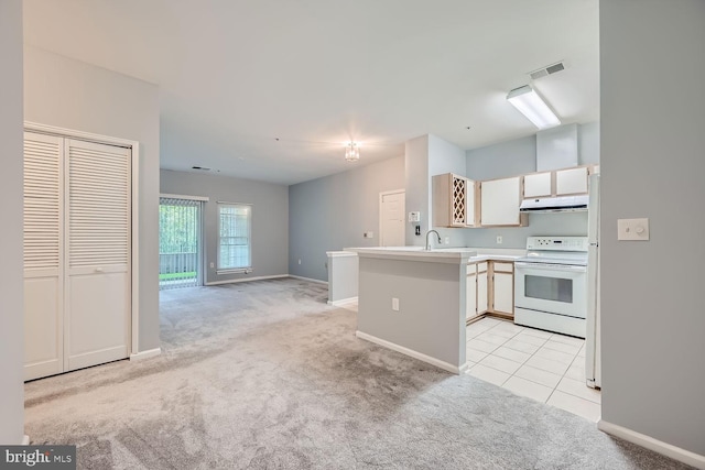 kitchen featuring kitchen peninsula, white electric range, light carpet, and sink