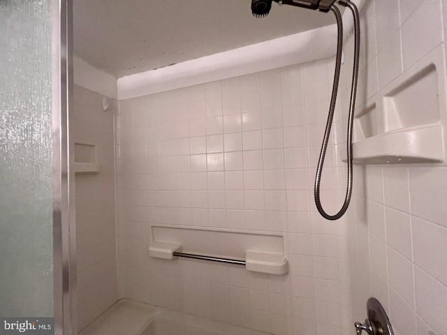 bathroom with a tile shower