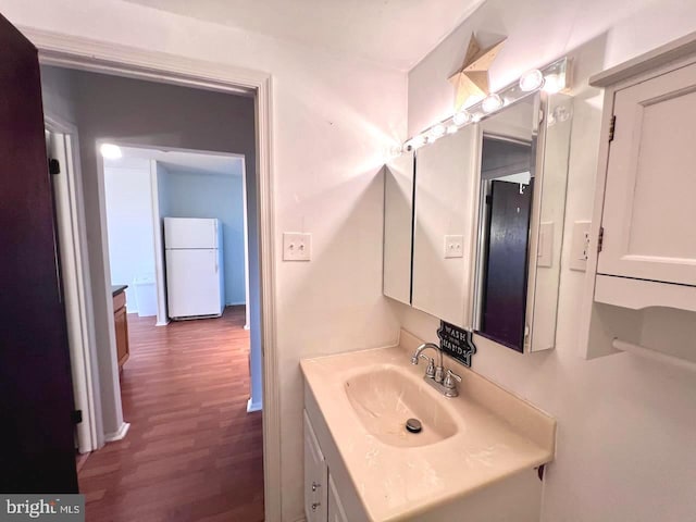 bathroom with vanity and wood-type flooring