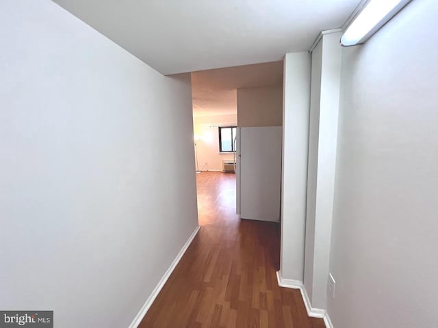 hallway with dark wood-type flooring