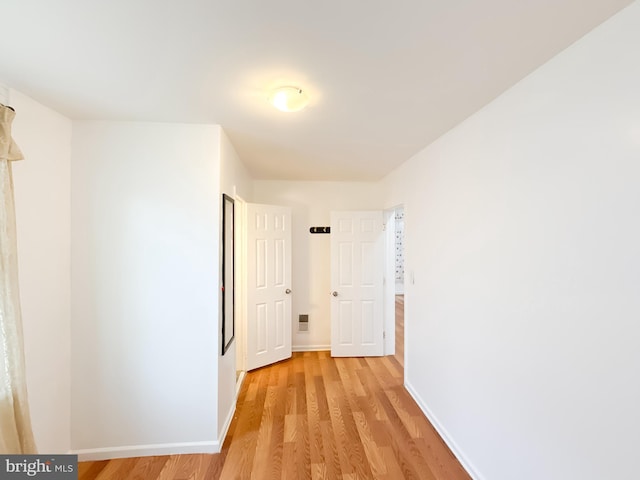 hallway featuring light hardwood / wood-style flooring