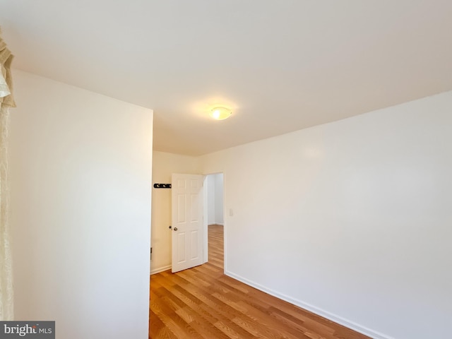 spare room featuring light hardwood / wood-style flooring