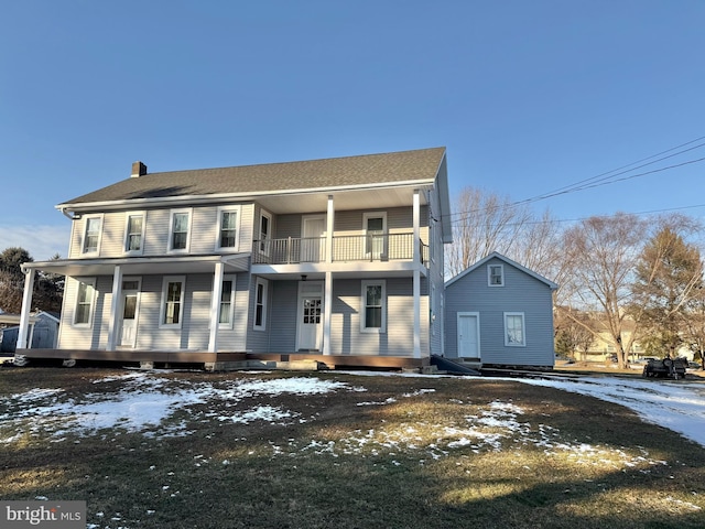 view of front of home with a porch and a balcony