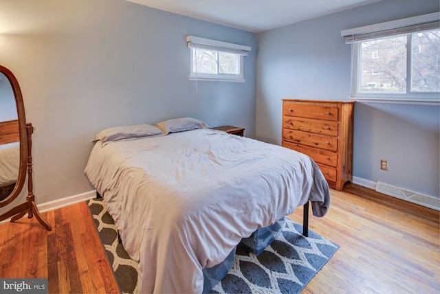 bedroom with hardwood / wood-style floors