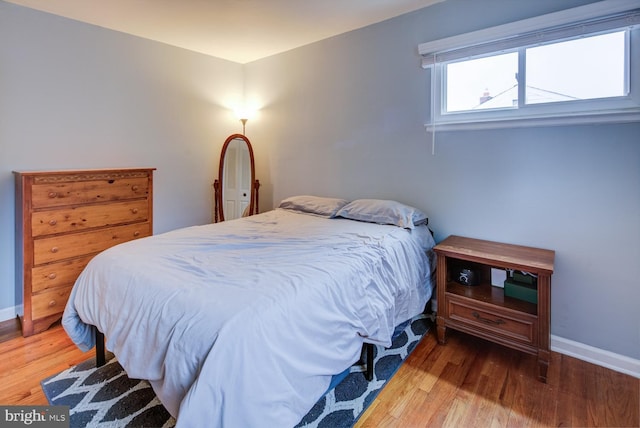 bedroom with hardwood / wood-style flooring