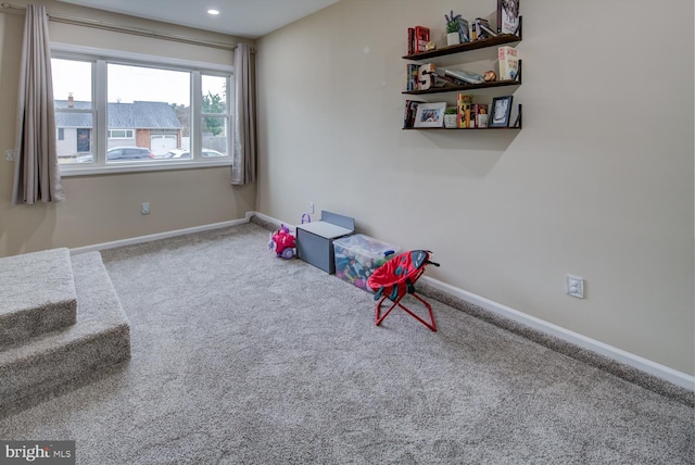 sitting room featuring carpet floors